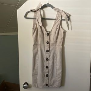 Canvas tan dress with brown buttons and faux tie straps